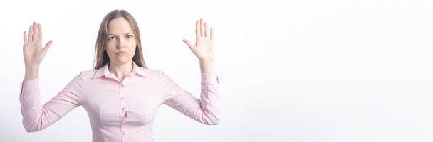 It was not me, I am innocent. Portrait of woman raising palms up in surrender and staring at camera with clueless anxious expression, standing against white background, copy space, banner - Фото, изображение