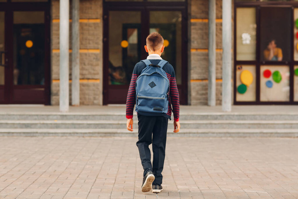 Young boy with backpack going back to school - Φωτογραφία, εικόνα