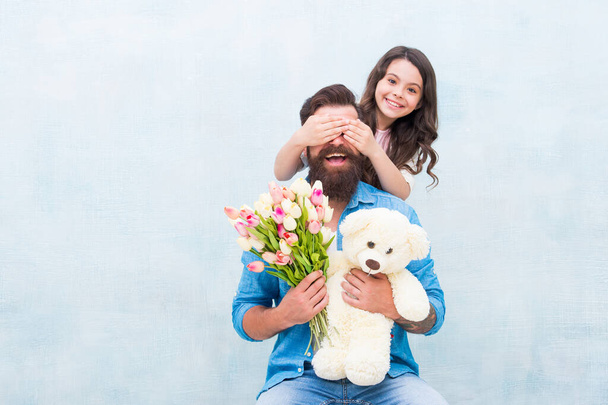 Guess who. Happy daughter clothes fathers eyes with hands. Playing guessing game. Birthday surprise. Surprise gift. Floral shop. Toyshop. Happy family. Spring holiday. Surprise concept, copy space - Photo, image