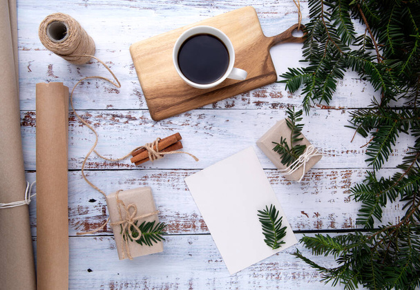 handmade gifts ,cup of coffee and card with pen on an old wooden table  - Zdjęcie, obraz