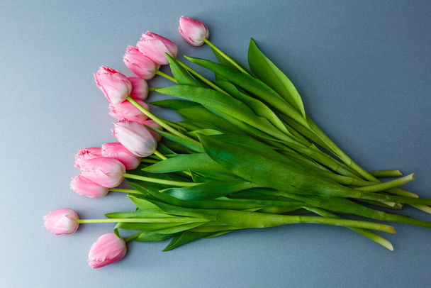 A bouquet of pink tulips on the table for International Women's Day - Zdjęcie, obraz