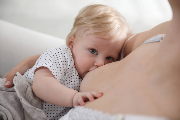 Mother breastfeeding her cute little baby, closeup - Foto, Bild