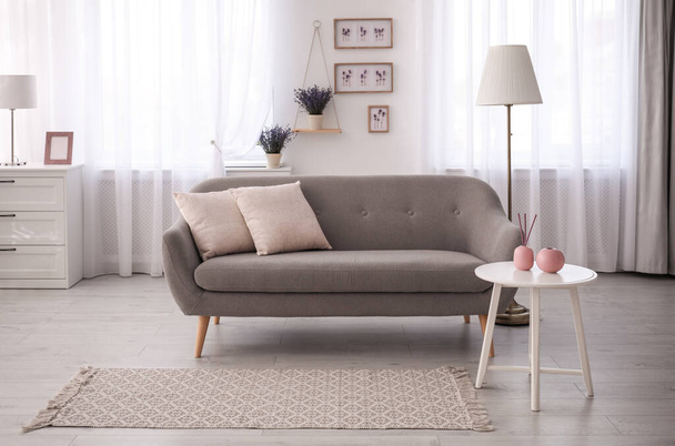 Stylish sofa in beautiful living room interior - Foto, imagen