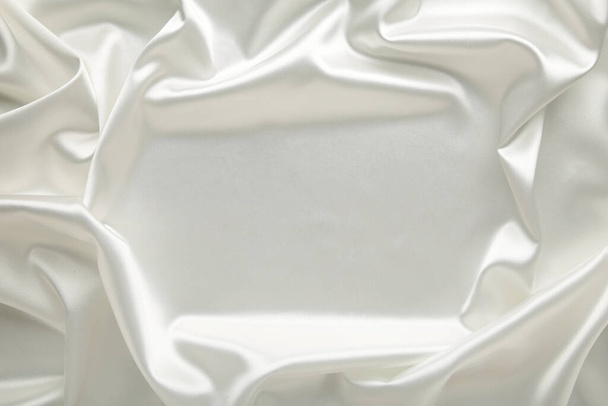 Smooth elegant white silk can use as background. Top view - Фото, зображення