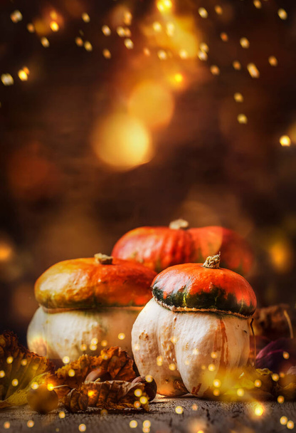 Happy Thanksgiving Day background, wooden table decorated with Pumpkins with light bokeh garland. Halloween concept. Beautiful Holiday Autumn Composition - Foto, Imagem