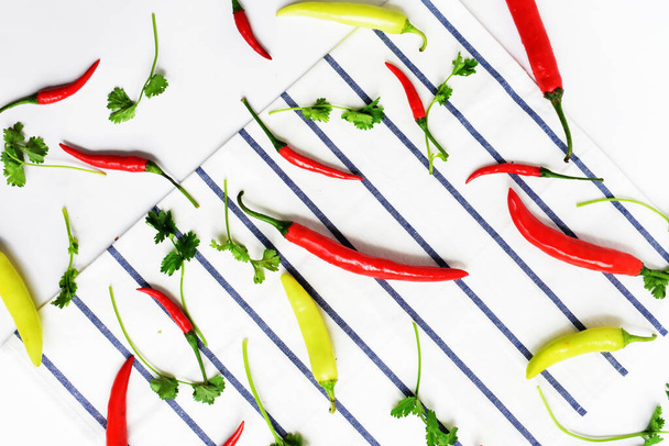 Red chili, green yellow chili peppers slices/cut/half isolated in white background, flay lay, top view, Thai chili in white table - 写真・画像