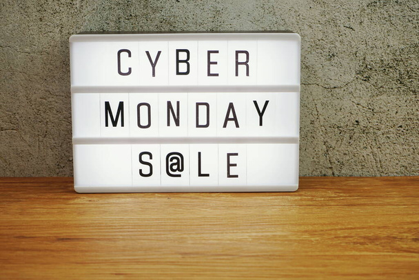 Cyber Monday Sale word in light box on wooden background - Фото, изображение