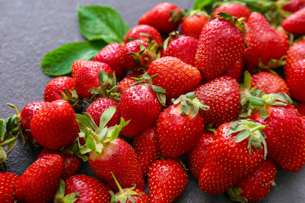 Fresh ripe strawberry on dark background, closeup - Фото, зображення