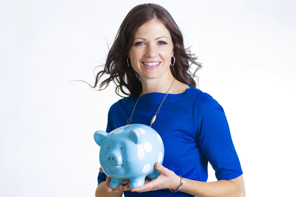 Великолепная женщина держит свой свиной банк
 - Фото, изображение