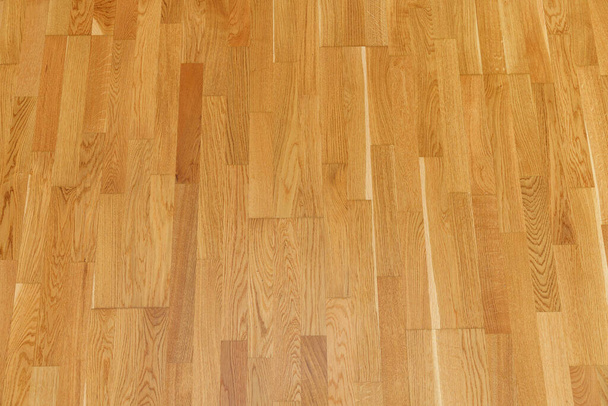 Brown laminate floor texture background. natural wooden polished surface parquet - Foto, afbeelding