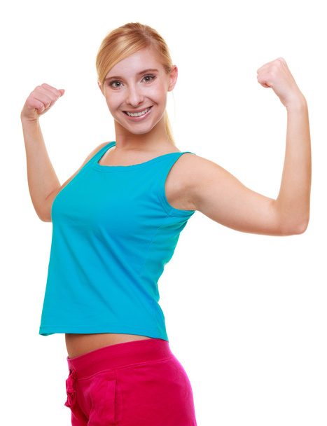 Sport woman fitness girl showing her muscles. Power and energy. Isolated. - Фото, изображение