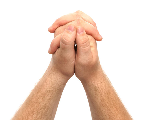 Las manos masculinas muestran un gesto de oración, piedad aislada sobre un fondo blanco - Foto, Imagen