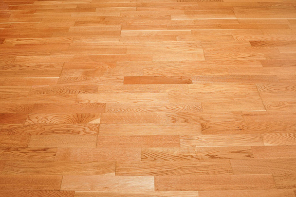 Bezešvé hnědé laminát podlahové textury pozadí. přírodní dřevěné leštěné parkety - Fotografie, Obrázek