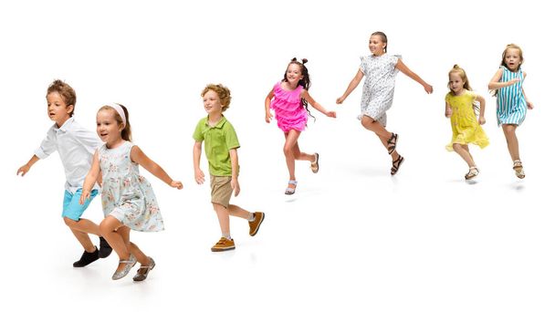 Happy little caucasian kids jumping and running isolated on white background - Fotoğraf, Görsel