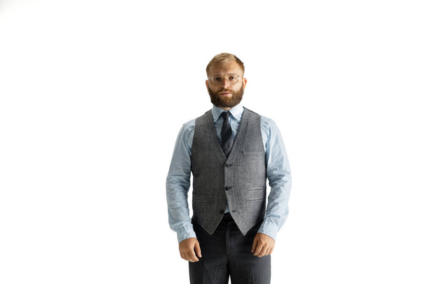 Cheerful handsome businessman isolated over white studio background - Photo, Image