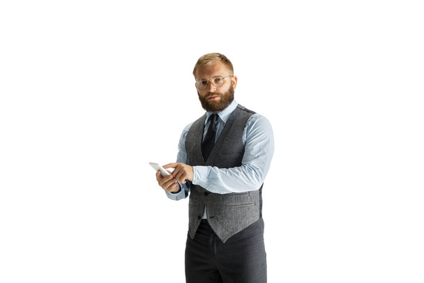 Cheerful handsome businessman isolated over white studio background - Foto, imagen
