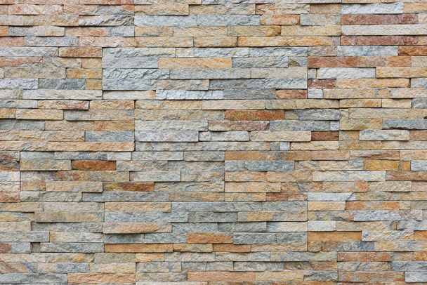 Naturalna elewacja kamień dekoracja kwarcyt tło tekstura. nowoczesna granitowa ściana kamienna - Zdjęcie, obraz