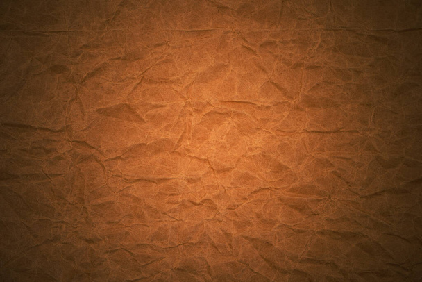 Textura de fondo de papel de embalaje arrugado marrón. Papel Kraft grueso. Bolsa de papel arrugado - Foto, imagen