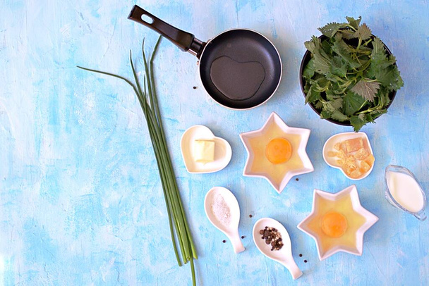 Ingredients for cooking an omelet with nettle. Italian food. Top view. - Photo, image