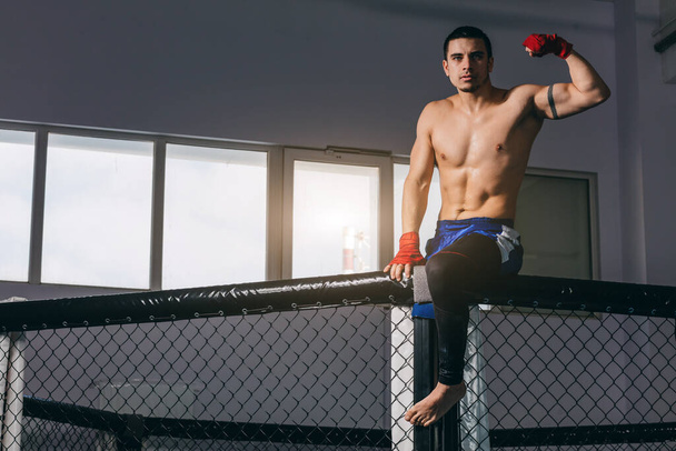 Kickbox professional fighter with naked muscular torso posing for a camera. - Valokuva, kuva