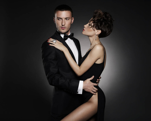 Fashionable photo of beautiful naked lady and man in suit. Pretty woman pose with fashionable boyfriend. Sexy couple of two lovers - Фото, изображение