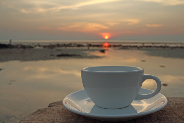 Morning coffee cup by the beach with sea sky background - Photo, Image