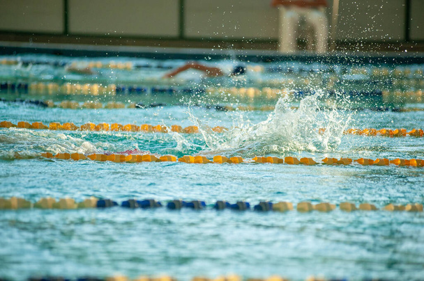 Photo of water splash in swimming pool. Water splashing. - Foto, Imagem