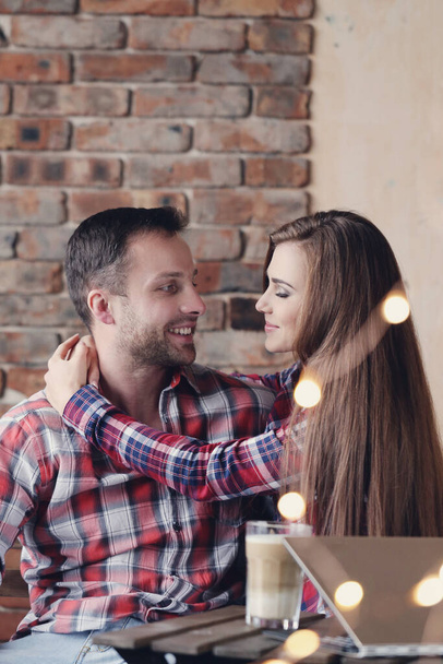 Love. Cute couple in the cafe - Фото, изображение