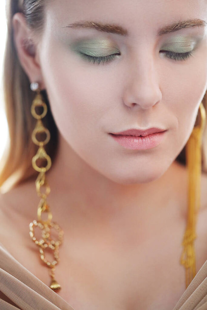 Fashion, jewelry. Lovely woman with beautiful earrings - Fotó, kép