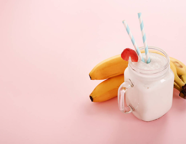 Delicious milkshake on a pink background - 写真・画像