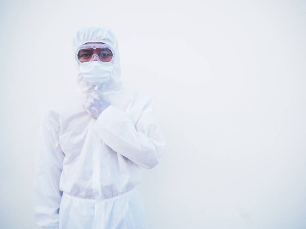 Portrait of confident asian male doctor or scientist in PPE suite uniform empty space deep thinking creative person hand on chin with looking ahead on white background. COVID-19 concept. - Photo, Image