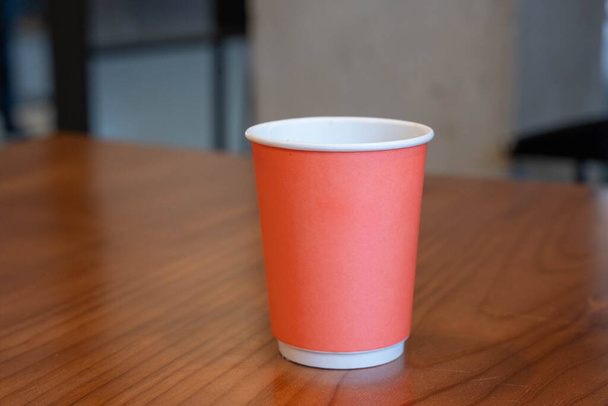 Paper cup on wooden table - Fotografie, Obrázek