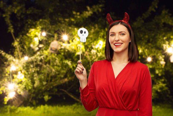 happy woman in red halloween costume of devil - Foto, immagini