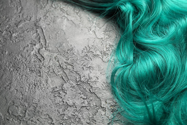 Unusual wig on dark background - Fotó, kép