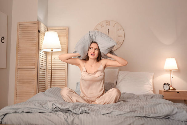 Stressed woman suffering from insomnia in bedroom - Fotó, kép