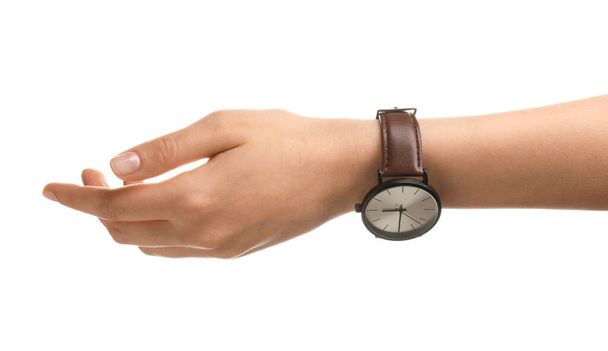 Kobieca ręka ze stylowym zegarkiem na białym tle - Zdjęcie, obraz