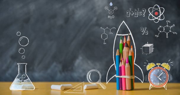 Back to school background with rocket made from pencils on chalkboard. Alarm clock, atom, chemistry. - Foto, afbeelding