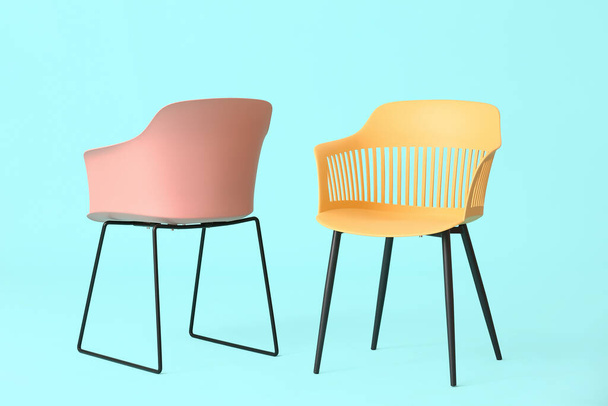 Modern chairs on color background - Photo, Image