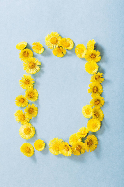 spring yellow flowers on paper background - Zdjęcie, obraz