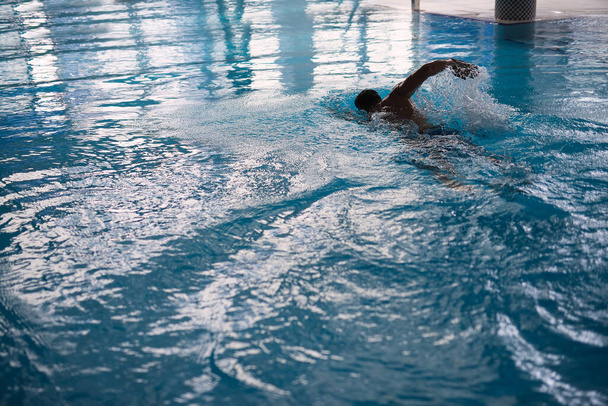 blurred image ,conceptual image of water sports, sports man doing  swim in water, - Zdjęcie, obraz