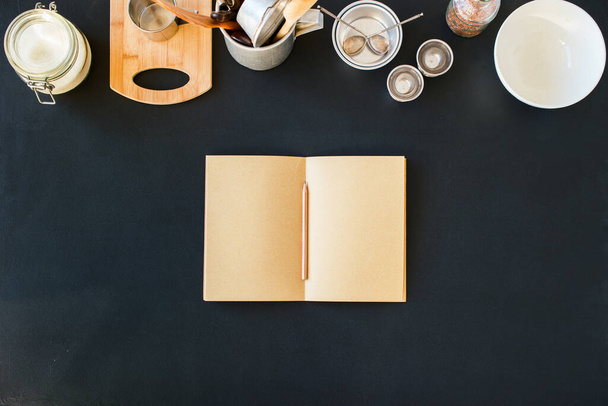 Empty Paper Blank Pages Notebook for Record Recipes Line Composition Tableware Preparation Cooking Kitchen Accessories Black Table Different Metal Dishes Ware Support Stuff Top View. Flat Lay Mock up - 写真・画像