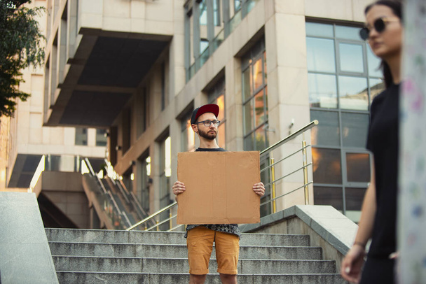 Dude with sign - man stands protesting things that annoy him - Photo, Image