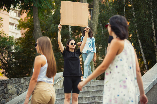 Dude with sign - woman stands protesting things that annoy her - 写真・画像