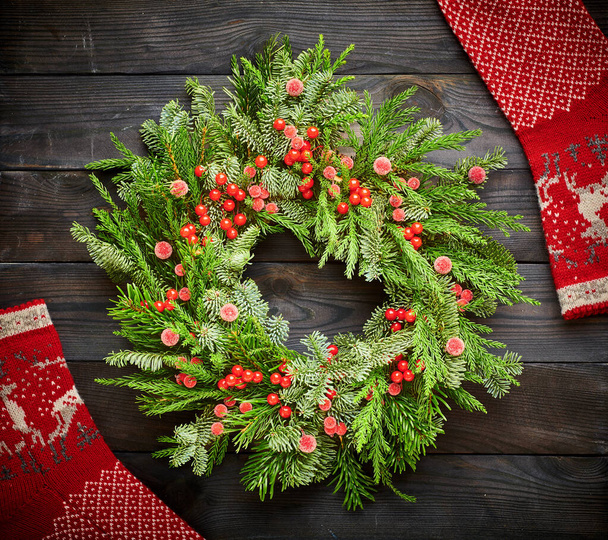 Christmas wreath on dark rustic wooden background - Photo, Image