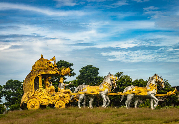 holly Arjuna chariot of Mahabharata in golden color with amazing sky background image is taken at murdeshwar karnataka india. - Photo, Image