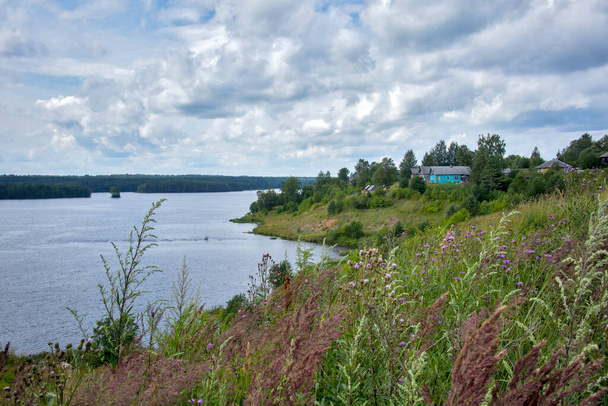Vologda Oblast, Russia, - 03 August 2020, Village in Podporozhye. View of the Volga-Baltic Canal. Forbs. - Zdjęcie, obraz