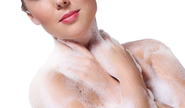 Soap foam, wash. Woman on a white background - Zdjęcie, obraz