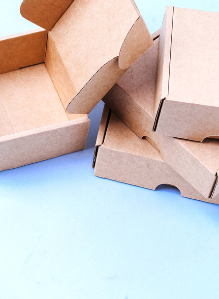 Carton boxes on a blue background - Foto, Imagem