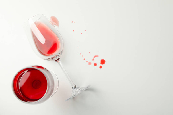 Glasses of wine on white background, top view - Photo, Image