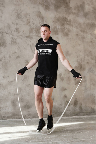 Man during skipping rope exercise - Photo, image